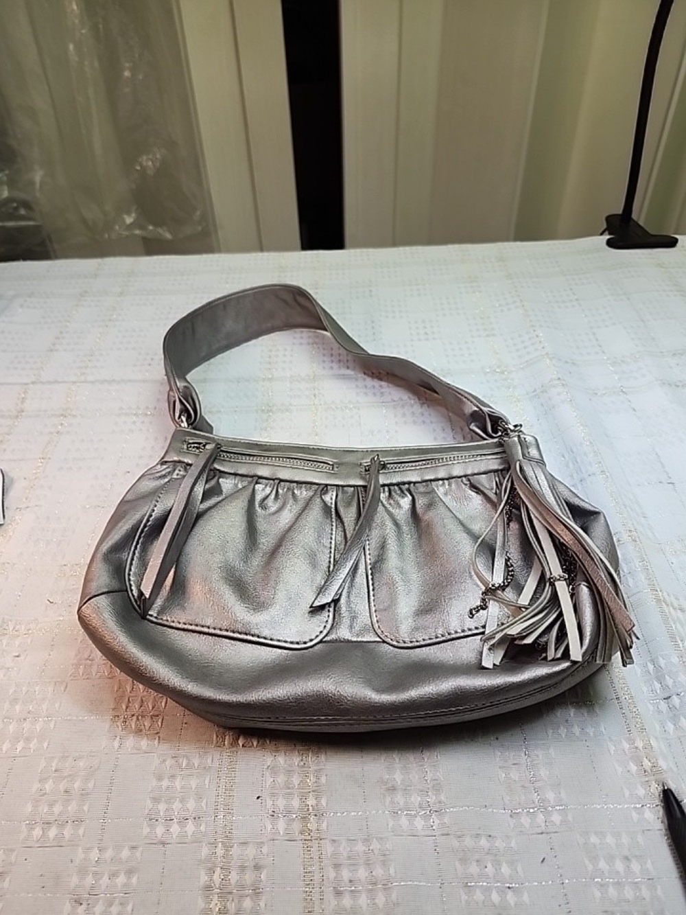 ACESS Metallic Silver Shoulder Bag with Tassel Accent